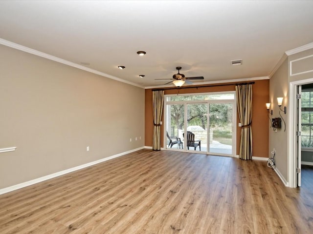 empty room featuring ornamental molding, light hardwood / wood-style floors, and ceiling fan