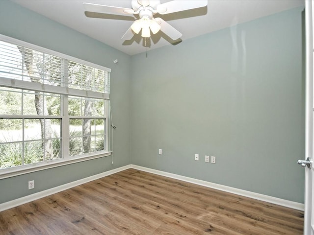 unfurnished room featuring hardwood / wood-style flooring and ceiling fan