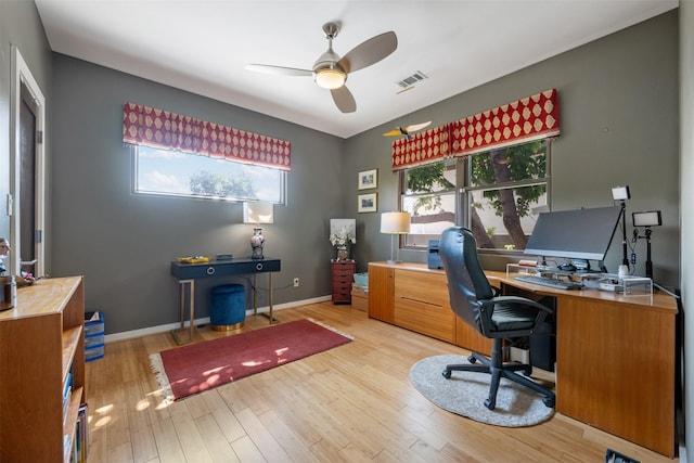 office featuring light hardwood / wood-style floors and ceiling fan