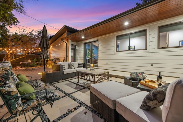 patio terrace at dusk with an outdoor hangout area