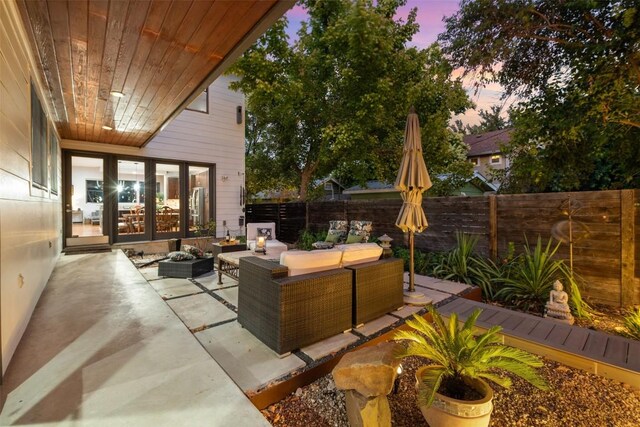 patio terrace at dusk with outdoor lounge area