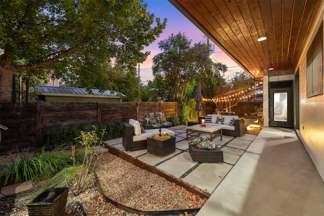 patio terrace at dusk with outdoor lounge area