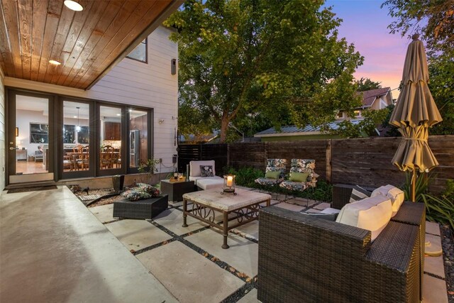 patio terrace at dusk with outdoor lounge area