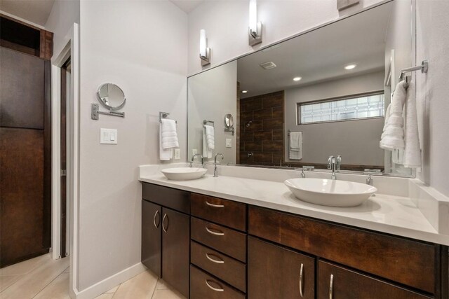 bathroom with tile patterned flooring and vanity