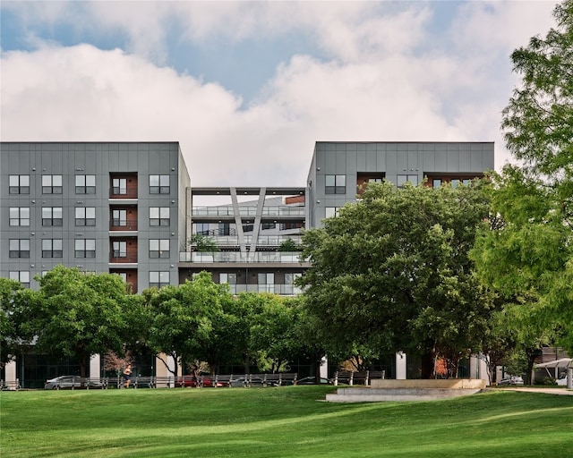 view of property's community with a lawn