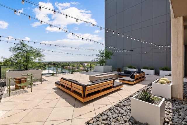 view of patio with an outdoor fire pit