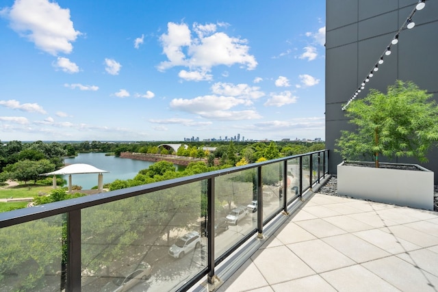 balcony featuring a water view