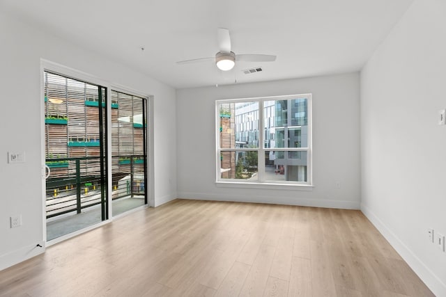 unfurnished room featuring ceiling fan and light wood-type flooring