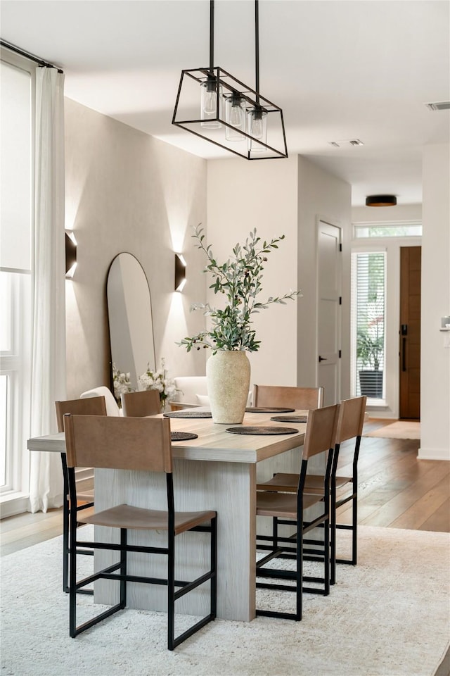 dining area with light hardwood / wood-style flooring