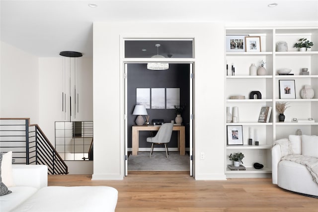 sitting room featuring light hardwood / wood-style flooring