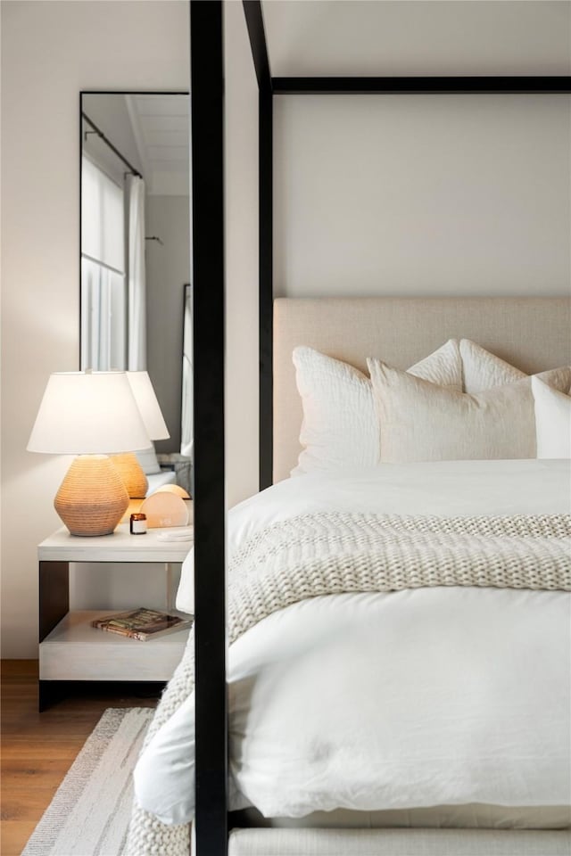 bedroom with wood-type flooring