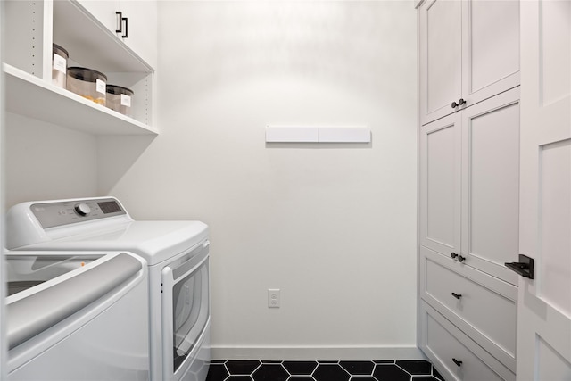 laundry area with cabinets and washer and dryer