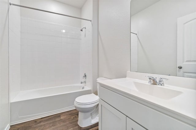 full bathroom with toilet, vanity, wood-type flooring, and tub / shower combination