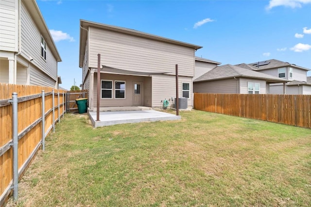 back of property featuring a yard, a patio, and central air condition unit