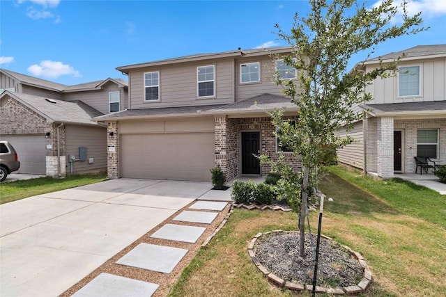 view of front of property with a garage and a front yard