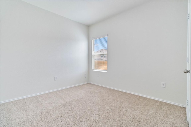 unfurnished room featuring light colored carpet