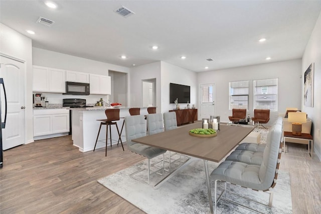 dining area featuring light hardwood / wood-style floors