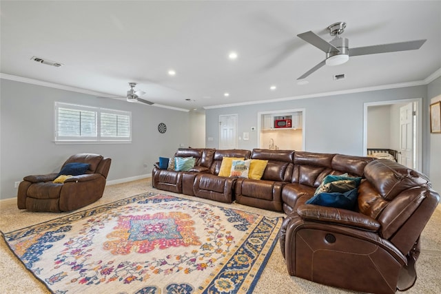 living room featuring carpet, ornamental molding, and ceiling fan