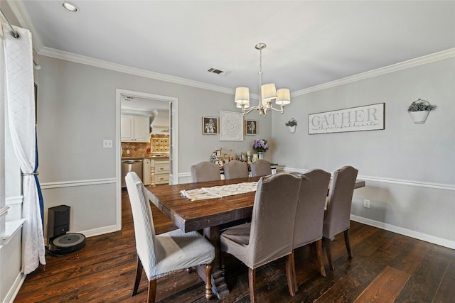 dining space featuring crown molding, an inviting chandelier, and dark wood-type flooring