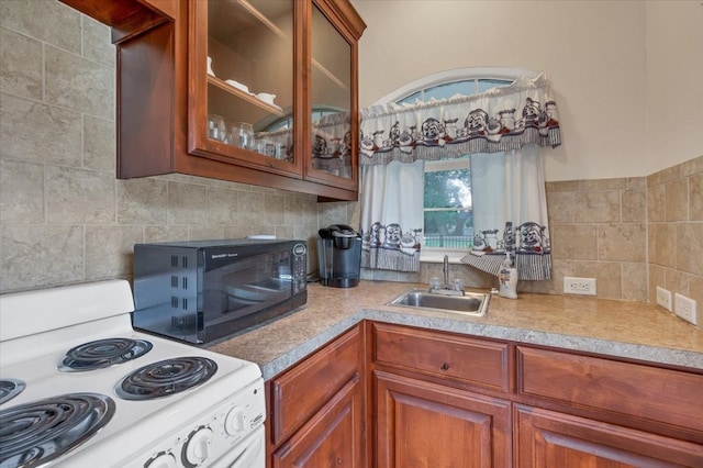 kitchen with sink, backsplash, and white electric stove