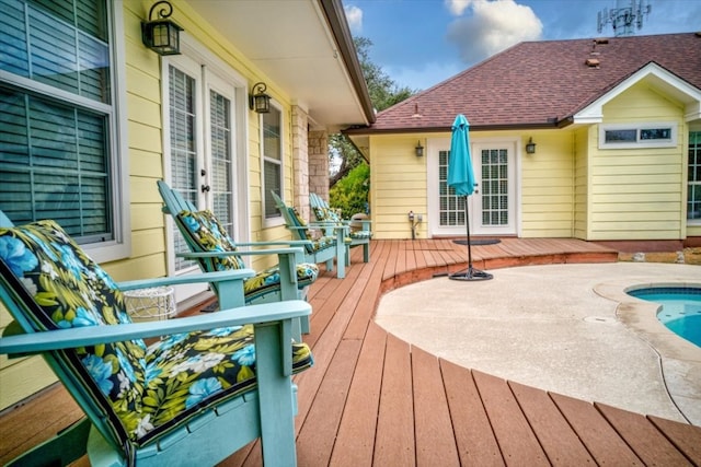 wooden terrace featuring a pool