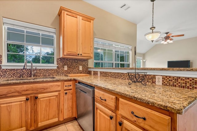 kitchen featuring vaulted ceiling, tasteful backsplash, dishwasher, ceiling fan, and sink