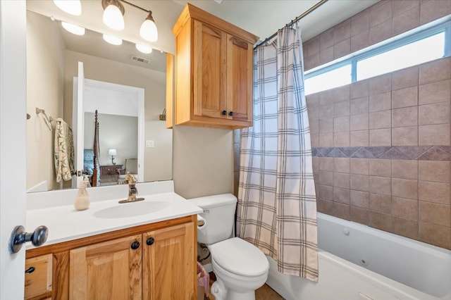 full bathroom with vanity, toilet, and shower / bath combination with curtain