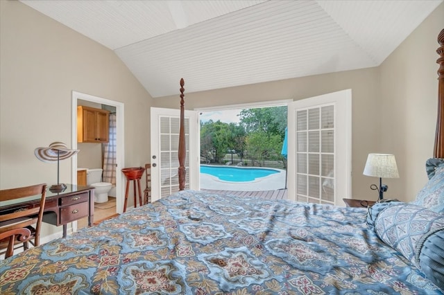 tiled bedroom with vaulted ceiling, ensuite bath, and access to exterior