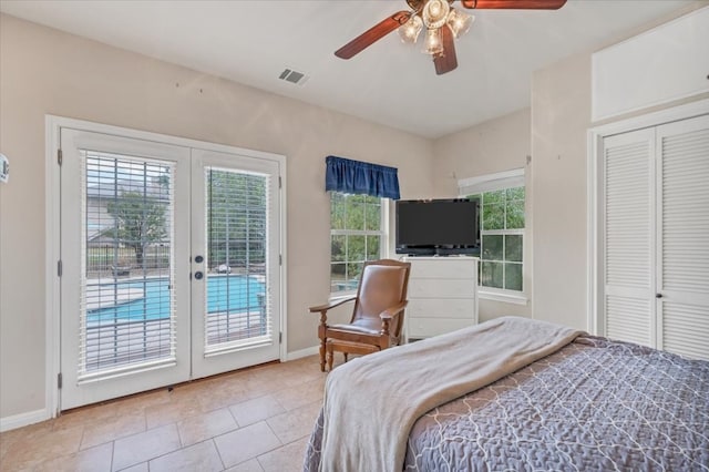 tiled bedroom with access to outside, a closet, french doors, and ceiling fan