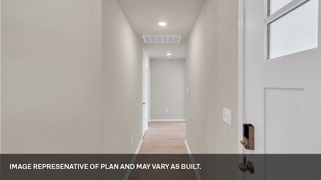 hallway with light wood-type flooring