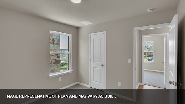 interior space featuring light hardwood / wood-style flooring and multiple windows