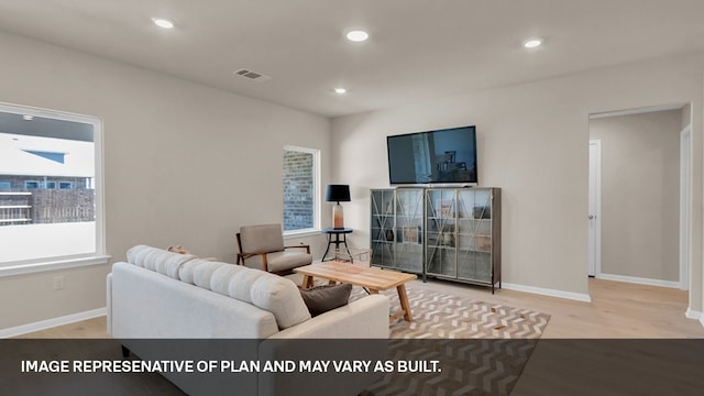 living room with light hardwood / wood-style floors