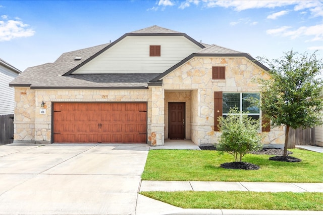 view of front facade with a garage and a front yard