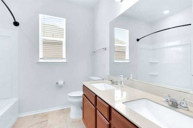 full bathroom featuring vanity, toilet, washtub / shower combination, and tile patterned floors