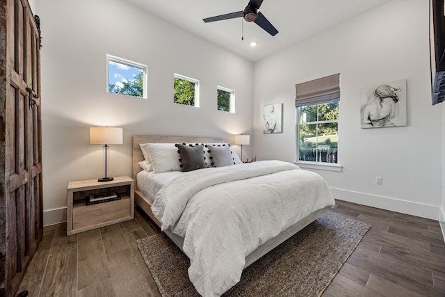 bedroom featuring ceiling fan and dark wood-type flooring