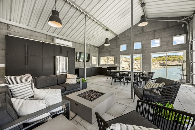 interior space featuring vaulted ceiling and a wall unit AC