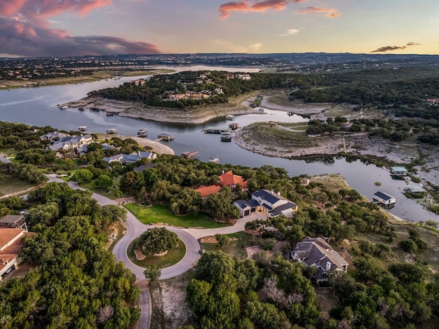 aerial view at dusk with a water view