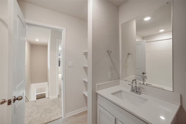 bathroom featuring hardwood / wood-style floors and vanity