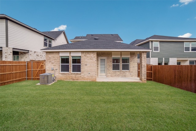 back of house with a patio, a yard, and central AC