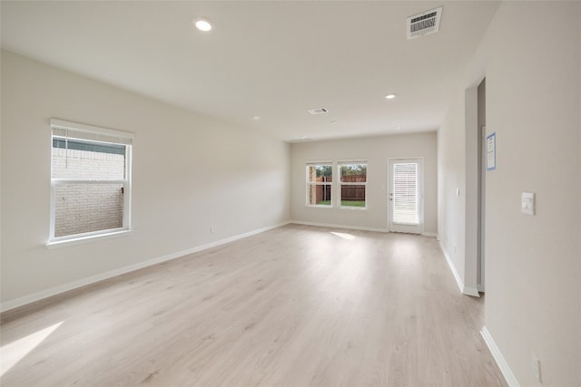 spare room with light wood-type flooring