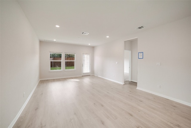 spare room featuring light hardwood / wood-style floors