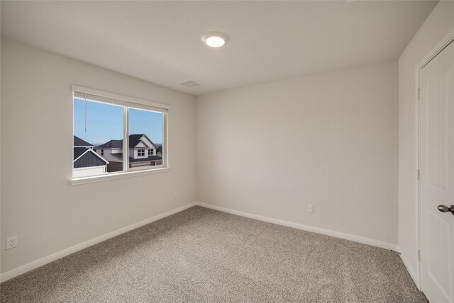 unfurnished room with carpet flooring