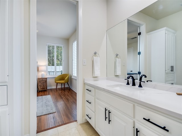 bathroom featuring vanity and hardwood / wood-style flooring