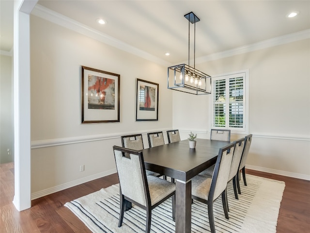 dining area featuring a chandelier, crown molding, and dark hardwood / wood-style flooring