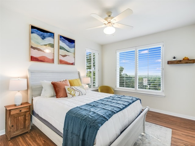 bedroom featuring ceiling fan and dark wood-type flooring