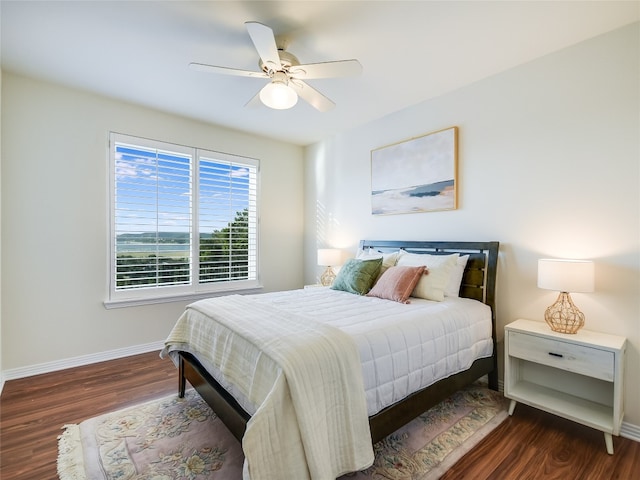 bedroom featuring ceiling fan and dark wood-type flooring