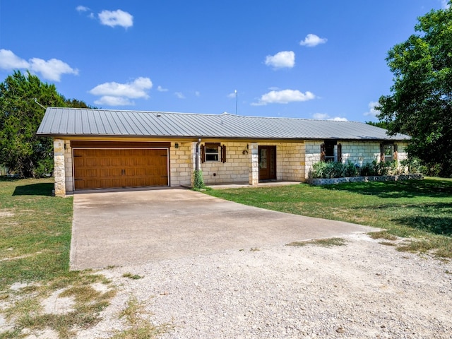 ranch-style house featuring a front lawn and a garage