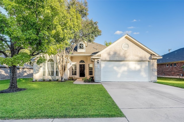 view of front of home featuring a garage and a front lawn