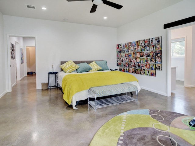 bedroom featuring ceiling fan and concrete flooring