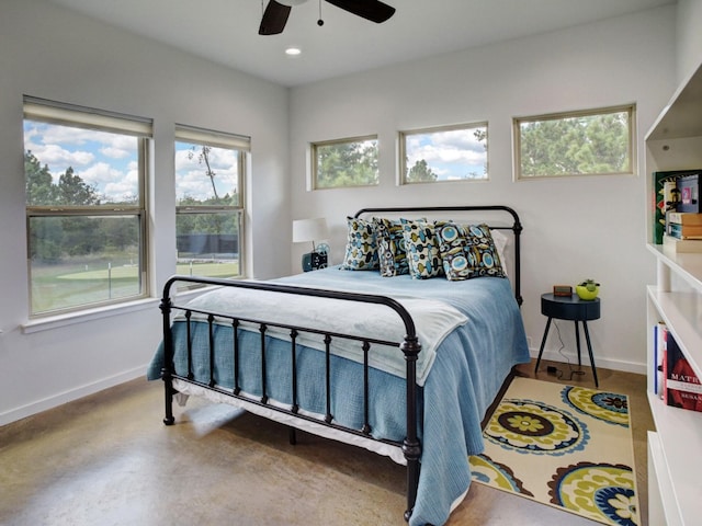 bedroom featuring concrete floors and ceiling fan